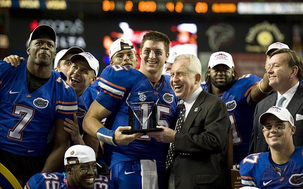 SEC Commissioner Mike Slive presents Florida Gators quarterback Tim Tebow